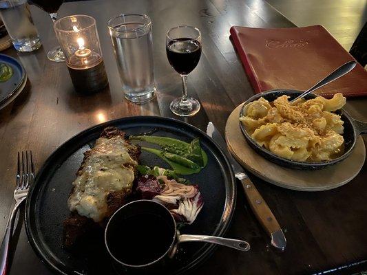 NY Strip with blue cheese, red wine reduction sauce (Barolo reduction) and a side of mac and cheese.