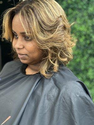 Custom blonde full head highlights and silk press and bob cut