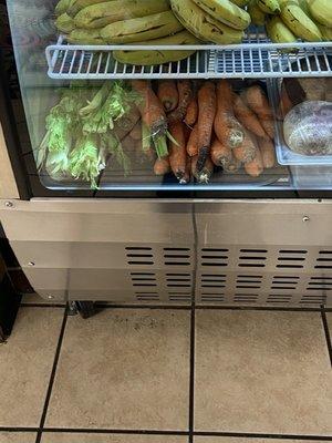 Moldy carrots and celery near products that are ready to serve, as well as the corn in the place it was very watery