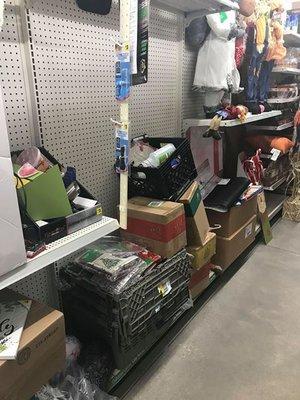 Boxes of product just tossed on shelves for customers to go through.