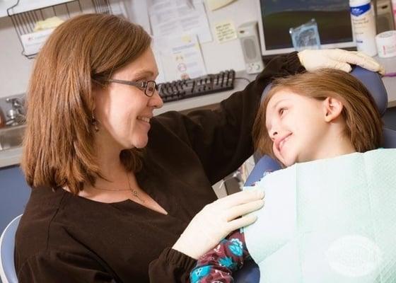 pediatric dentist with child patient