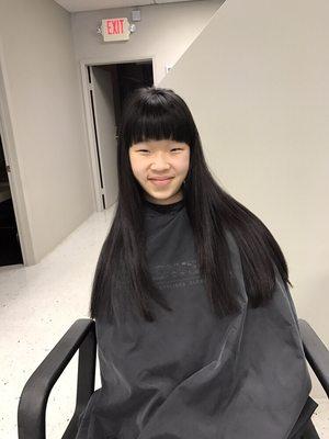 Blunt long haircut with wispy bangs