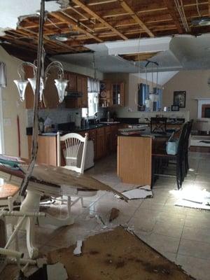 Water damage to a home after a pipe break on the second floor.