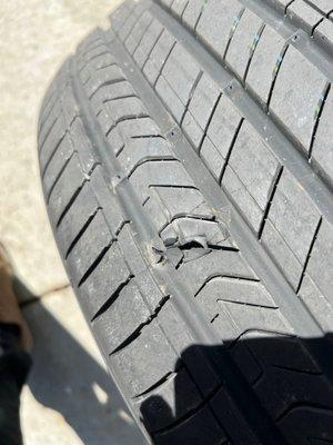 the blown brand-new tire (5days old) that the dealer manager said it was a cut or damage due to some sharp object and refused to replace it.