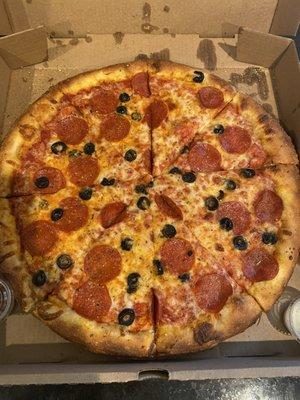 Large pizza with pepperoni and black olives