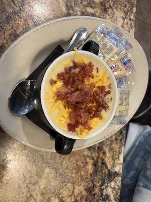 Potato soup. Lots of cheese and bacon on top.