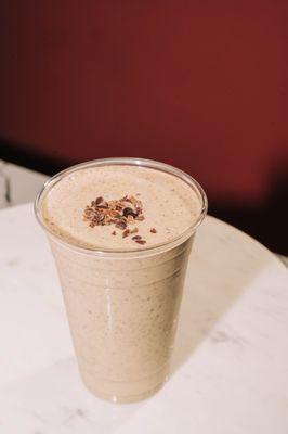 Peanut Butter Protein smoothie with your choice of milk, your choice of protein, plus bananas, cacao nibs, and no added sugars