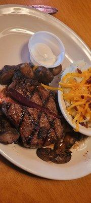 8oz NY strip med-rare with mushrooms (waitress asked us to cut into it to make sure it was just like we wanted....mushrooms has been on top)