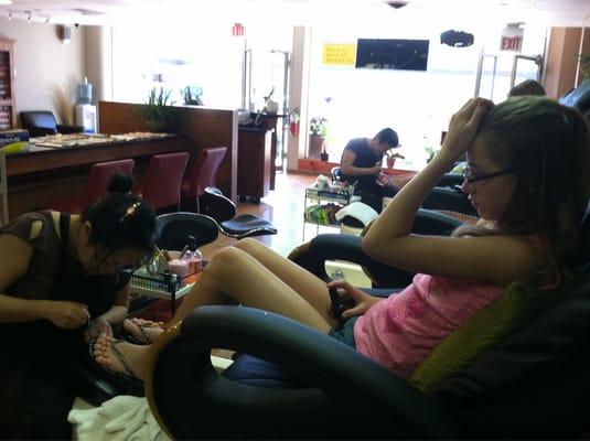 My daughter getting her nails done so she all ready for the first day of school