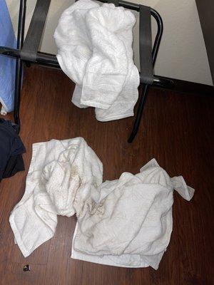 our three towels that were drenched in cleaner. floor was so nasty we had to use them to walk around on.