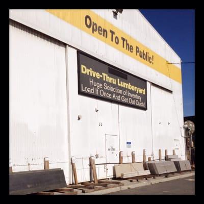 Exterior of warehouse, notice drive-thru yard banner & granite slabs @  bottom