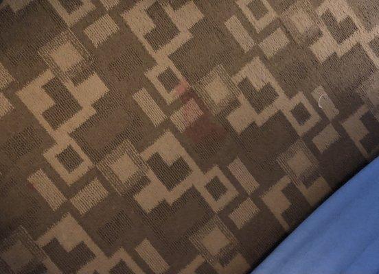 Mystery red stains on carpet