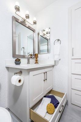 High Function custom Shaker vanity for West Palmdale Bath remodel. Over size lower drawer with heavy-duty glides with soft close mechanism.