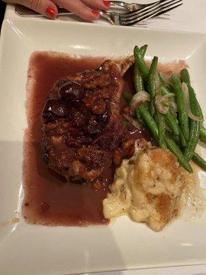 Grilled Pork Chop , Marinated And Grilled To Your Specifications With Toasted Pecans And A Rich Cherry Demi - glace