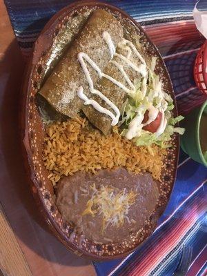 Cheese enchiladas with green sauce, beans and rice