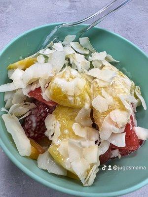 Mama fruit salad with condensed milk and coconut flakes