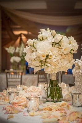 Timeless bouquet with a mixed arrangement of white flowers and pearl accents.