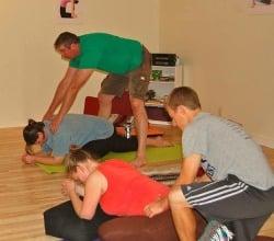 Dads learn hands on ways to assist moms in the Yoga for Birth workshop