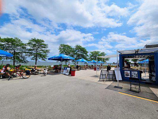 View of the beer garden and lake on a summer afternoon.