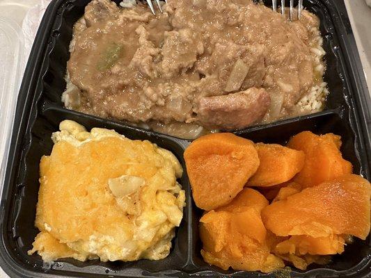 Smothered pork chops, Mac n cheese, candied yams