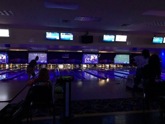 Saturday night bowling. With big screens of college football .