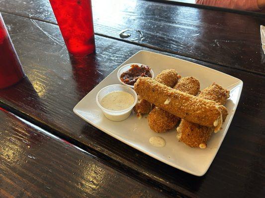 Poblano Wrapped Mozzarella Sticks. We already ate one before the photo