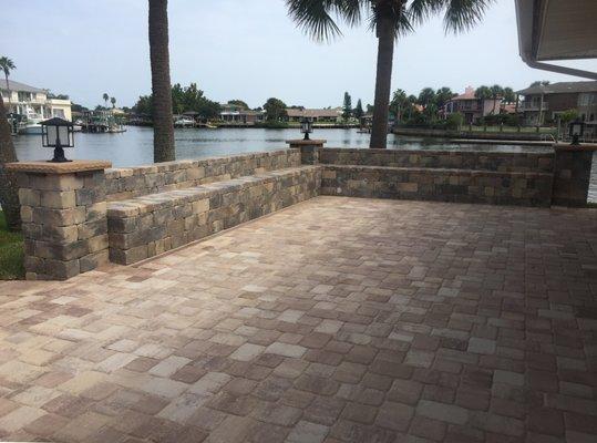 Structural retaining wall with built-in seat and paver installation for Commercial Property.