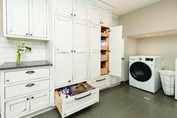 Laundry room cabinets with extra large drawer for dog food! Crown Cabinetry meets all your needs.