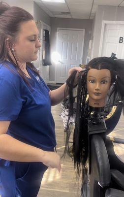 "At Blueprint Hair Academy, students of all backgrounds excel in Natural Hair skills, like this stunning braiding technique by our talented