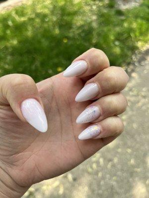 White acrylic stiletto nails with iridescent glitter