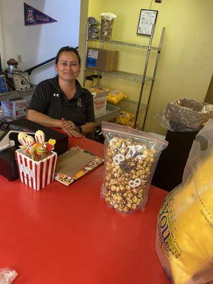 I stop by on a whim. I spotted this special holiday mix coming up: caramel popcorn, M&Ms, almonds, and Coated pretzel.