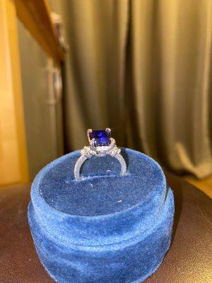 Custom engagement ring. Sapphire with diamond side stones and diamond and platinum band.