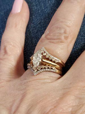 The center marquise engagement ring I received from Delage Jewelers with 2 Chevron Diamond band guards in champagne and white diamonds.