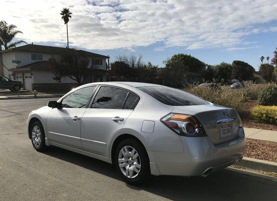 2012 Nissan Altima left rear view of the tinted windows.