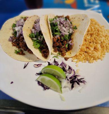 Tacos de Chorizo with a side of rice.