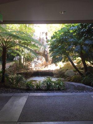 Beautiful waterfall upon entering building