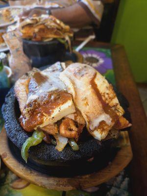 Molcajete with chicken,fish, shrimp, steak, and cactus