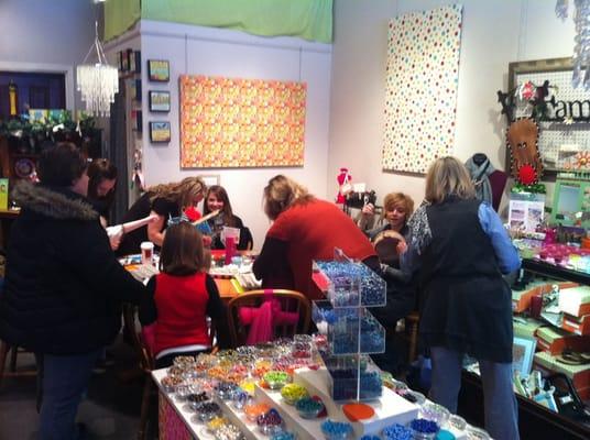 Jewelry making table in the back.