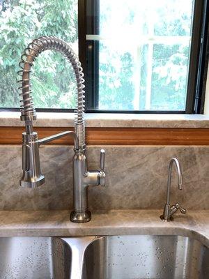 Installation of new Kohler kitchen sink faucet.