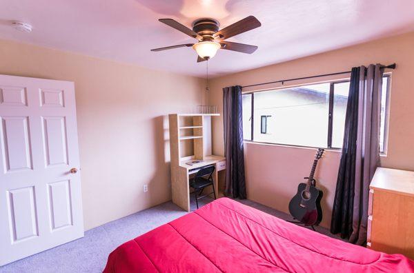 Private bedroom in Pacific Beach. Our private bedrooms are typically furnished with a full size bed, a desk, and some shelves/cubbies!