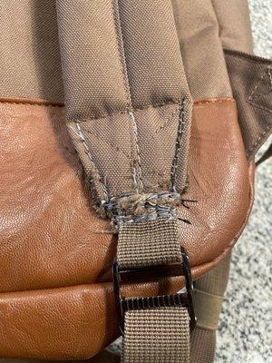 Photo of the badly mangled strap after their "repair"