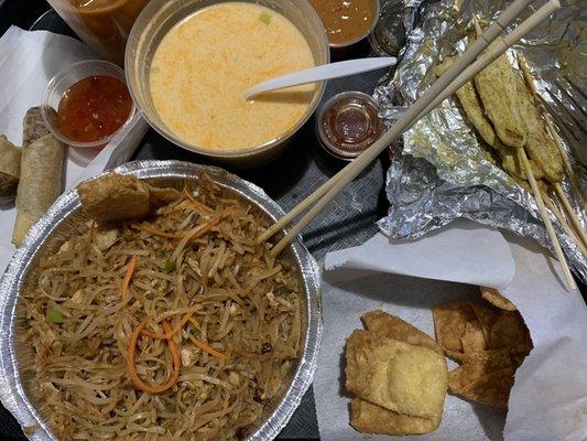 Chicken pad Thai, Tom kha soup, crab Rangoon, chicken satay and Thai crispy rolls