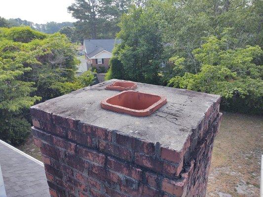 Before no chimney cap with multi-flue chimney, mortar cracked on top of chimney crown or wash