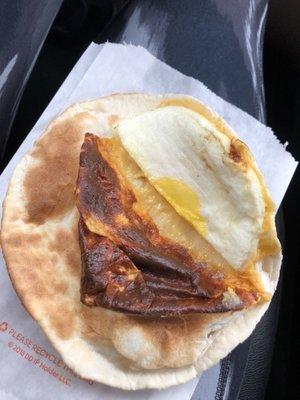 This is suppose to be an egg & cheese wrap. Ordered two both looked burnt like this. Ridiculous.