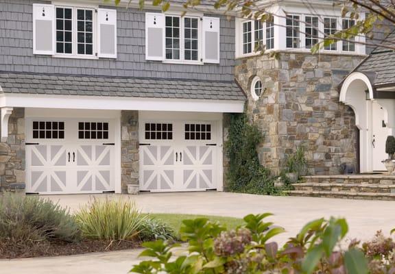 Two-toned double garage door with windows and decorative hardware$$$$