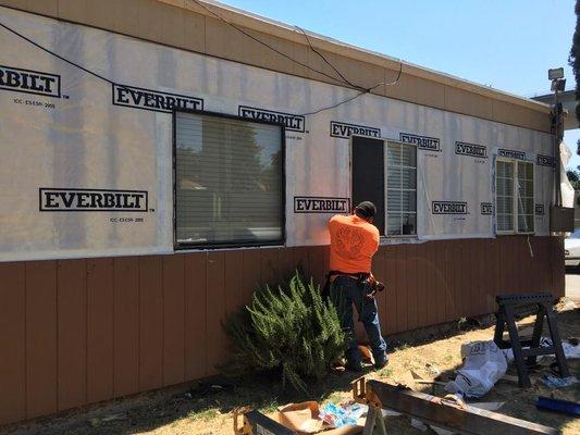 Phoenix Roofing changing out dry rot on the Stockton Family Shelter