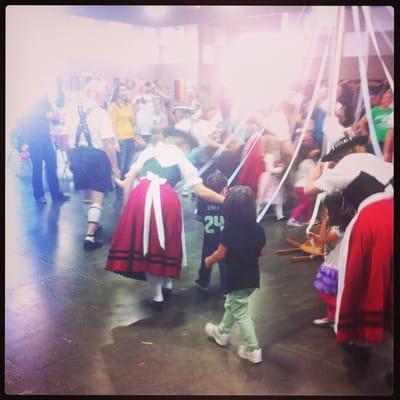 Dancing around the May pole