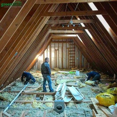 air sealing attic floor of existing home before blowing in 18" of cellulose insulation over the existing fiberglass insulation