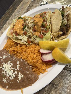 Fish tacos and a carnitas taco with rice and beans