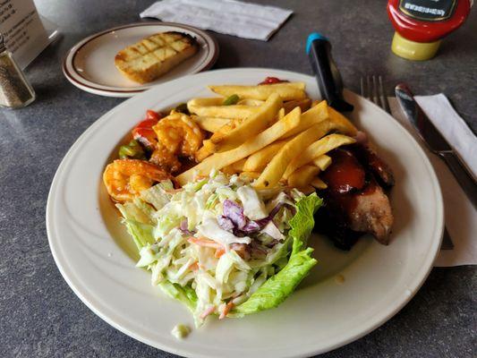 Surf and turf lunch special with prawns, tri tip, jicama coleslaw and fries.